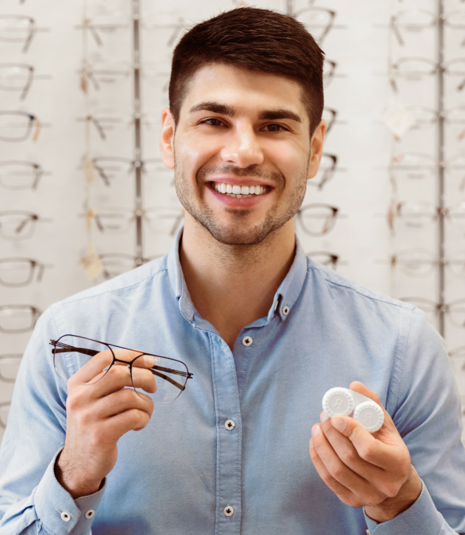 A,Man,Stands,In,An,Eyewear,Store,Showcasing,A,Pair